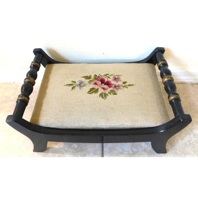 Wonderful vintage mid-century Hitchcock floral needlepoint footstool. Black ebonized wood with gold trim. Floral...
