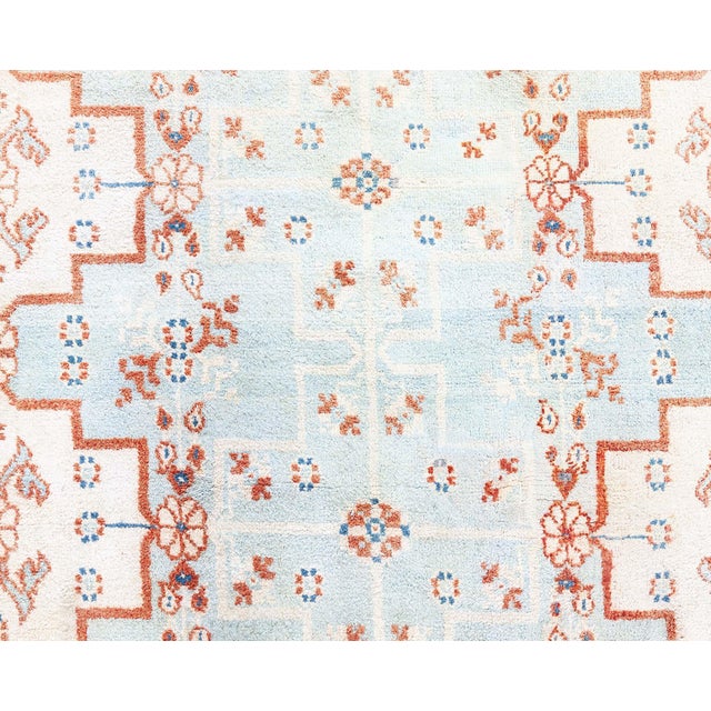 This traditional vintage Cotton Agra rug is an exquisite representation of classic Indian weaving artistry. Featuring...