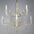 Eight-light Italian style carved wood two-tier chandelier with remnants of paint throughout. This fixture has a beautiful...