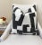 This graphite and cream pillow offers a bold, modern take on neutral tones. Featuring a deep graphite pattern against a...
