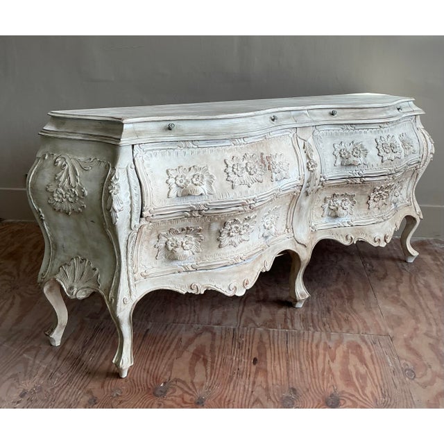 Embrace timeless European elegance with this magnificent vintage bombe double dresser. Its dramatic, swelling silhouette...