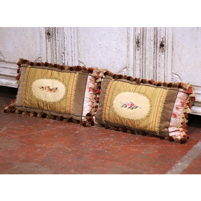 This elegant pair of decorative lumbar pillows is crafted with antique 18th Century French Aubusson tapestry fragments,...