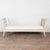 19th century Swedish Gustavian bench crafted in pine. This backless settee features graceful arms that curve slightly...