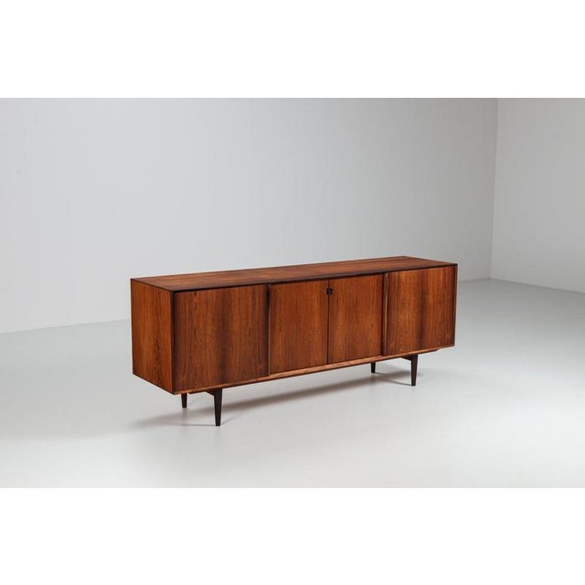 Beautiful sideboard, designed by Henry Rosengren Hansen and produced by Brande Møbelindustri in Denmark in the 1960s. It...