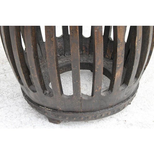 1 Charming Q'ing Dynasty style garden stool Hand carved in fir. Measures: 19'' H x 16'' W x 16'' D.