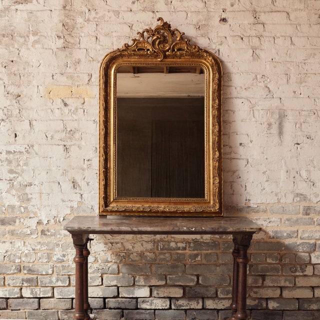 Elevate your space with this 19th century French Louis Philippe Rococo style mirror, a striking blend of refined...