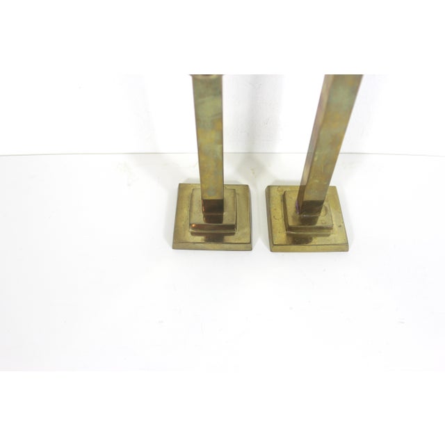 Pair of vintage brass candle holders. Please take a close look at the photos to see the patina. They hold a taper candle....