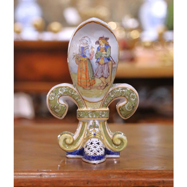 Bring regional Breton artistry to a shelf, console, or cabinet with this sculptural antique faience vase, crafted in...