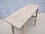 A wonderfully rustic console table crafted from solid elmwood, dating to the first half of the 20th century. The simple,...