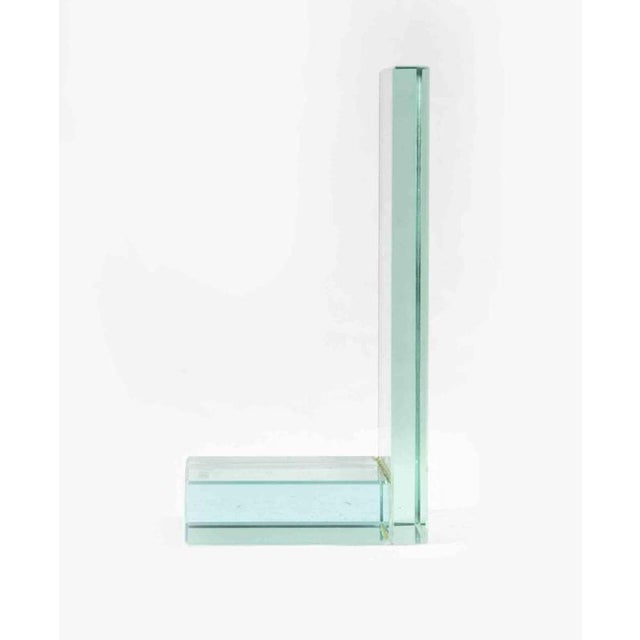 Glass bookend is an original decorative object realized in the 1970s. A mid-century bookend entirely realized in glass....