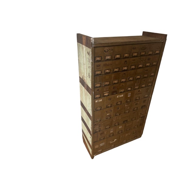 Authentic early 20th-century American industrial hardware store cabinet attributed to W.C. Heller & Co., featuring...
