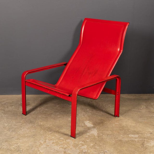 A 20th century minimalist red leather chair designed by jacques toussaint and patrizia angeloni, and produced by matteo...