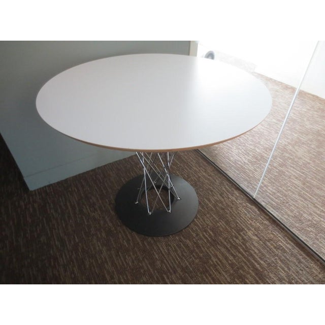 The Knoll Cyclone Dining Table (36 inches), designed by Isamu Noguchi in 1957, is a stunning blend of art and...