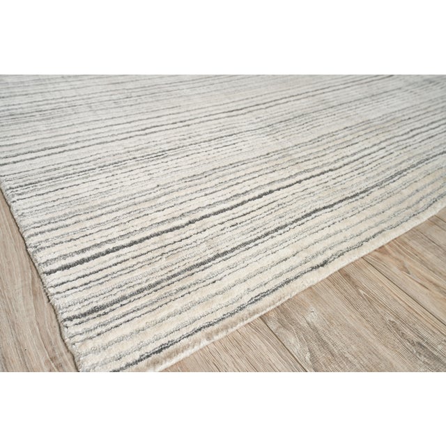The Rossini rug was designed to ground any room with its lush softness, rich dimensional texture and striated design. Made...