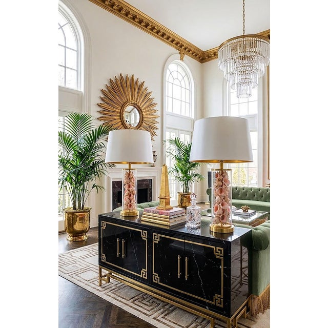 Offering a unique rare pair of Ralph Lauren glass table lamps filled with pink murex seashells, circa Late 20th Century....