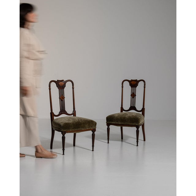 Here is a chair, its dark walnut with inlaid shell marquetry the first thing to catch the eye. The piece dates to 19th...