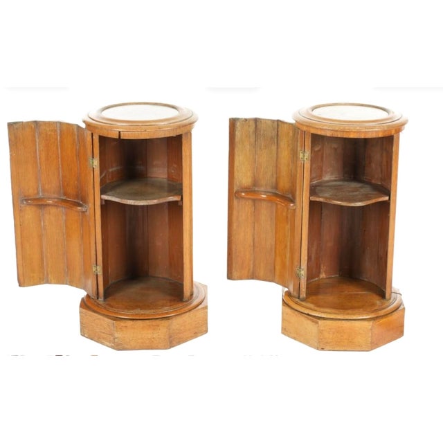Pair of English Cylinder-Form Bedside Commodes with Marble Tops. Each commode features a circular inset marble top, a...
