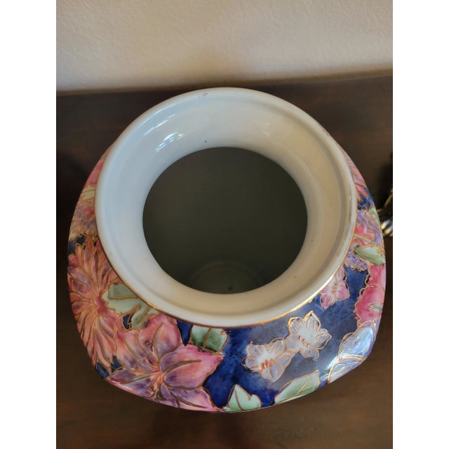 Beautiful vintage Cobalt blue Asian porcelain vase with hand painted colorful floral designs, etched in gold color....