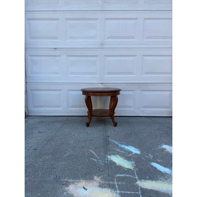 We have a beautiful vintage French Provincial marquetry side table for sale featuring a beautiful inlaid floral top,...