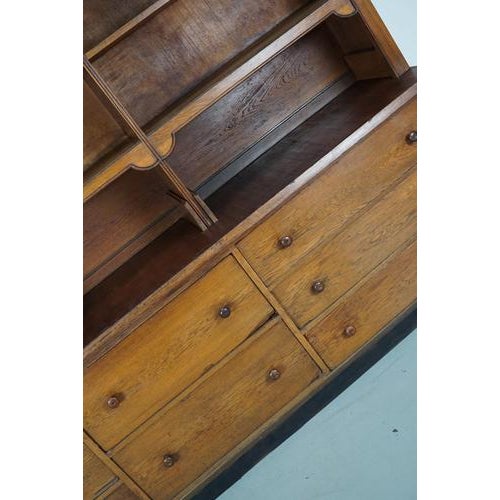 This shop cabinet was made around the 1920s in Germany mainly in oak and oak veneer. It was used in a chocolate shop near...