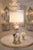 Offering an extra-large vintage seashell table lamp with distressed gold leafed base and seashell finial, circa 1950s....