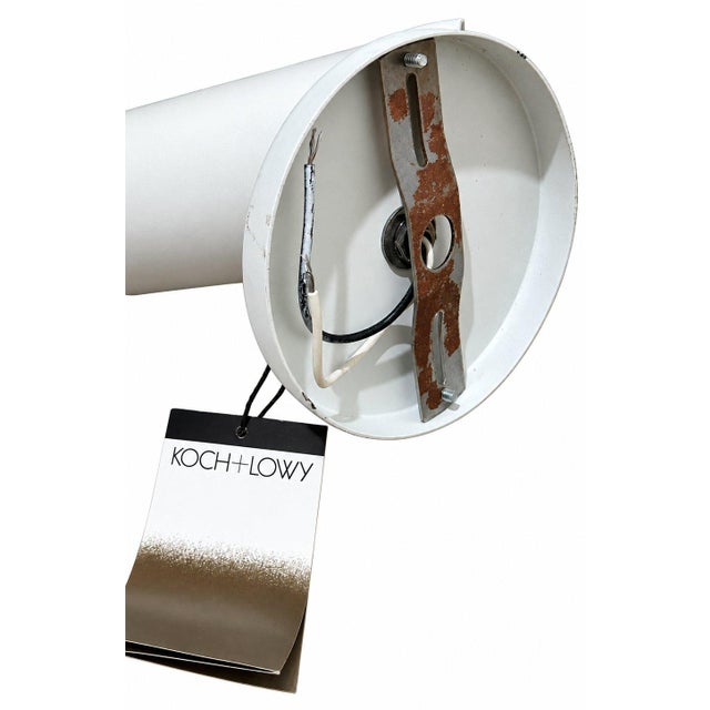 Stylish Koch + Lowy table lamp with a clean mid-century modern design. The lamp features a white cylindrical metal shade...