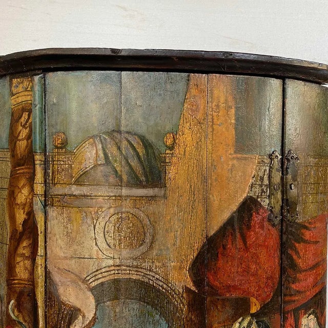 DETAILS An antique hanging one-door bowfront cupboard with a hand painted scene. STYLE Georgian COLOR(S) Polychrome PLACE...