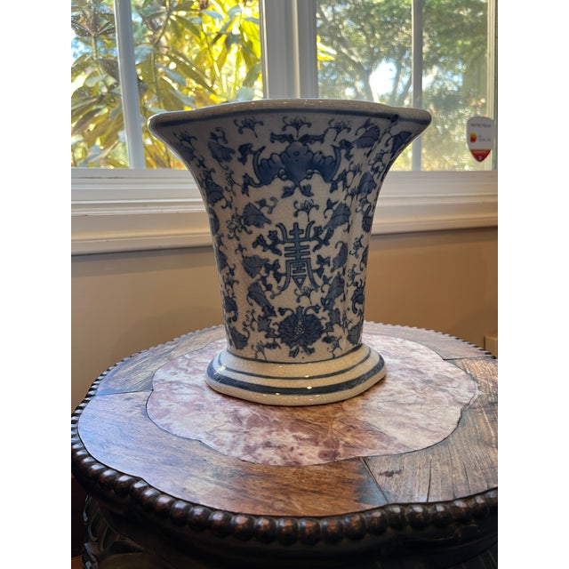 Add a touch of auspicious elegance to your space with this hand-painted Chinese porcelain vase. This piece features a...