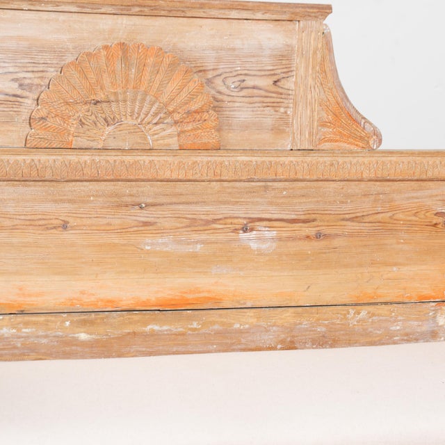 Early 19th-century Swedish Gustavian bench crafted in pine, retaining remnants of its original painted surface with a...