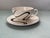 A charming abstract tea cup & saucer with metallic details in very good condition with light wear from use. -Saucers...
