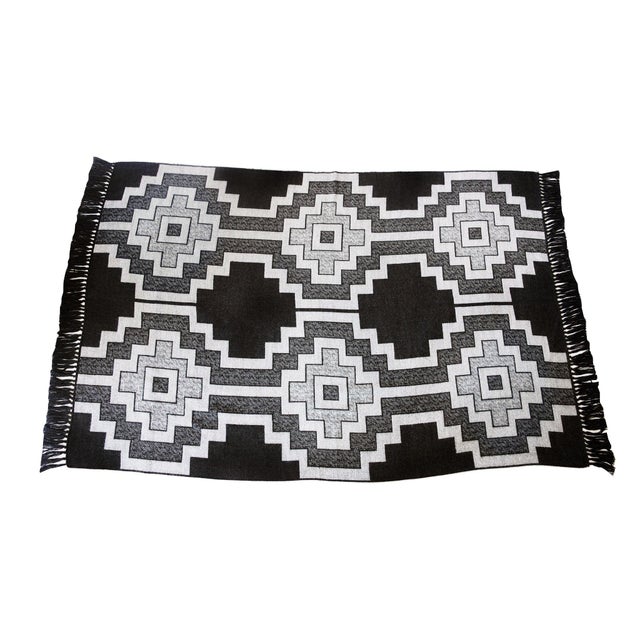 DESCRIPTION Jacquard loomed throw blanket of baby alpaca inspired by the Pampa design of the Mapuche Indians with...