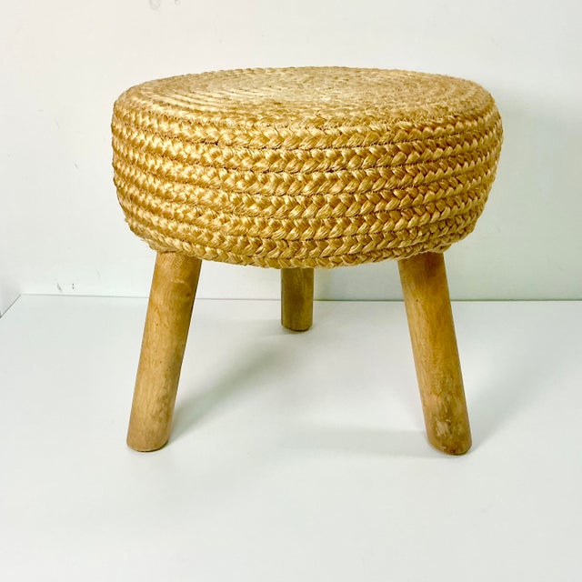 This Boho Chic low stool is a fabulous design. It features a deep woven jute seat cushion on three large round stub wooden...