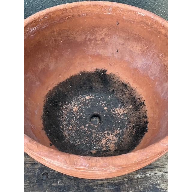 This pair of vintage terracotta planter bowls embodies the effortless charm and organic appeal of Mediterranean garden...