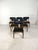Beautiful set of 6 diningchairs in teak and black skai. In absolute very good condition with lovely shaped legs and very...