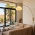 The Morelli Wall Mounted Arc Lamp is a Peter Morelli-designed modern lighting fixture with a weathered brass finish and a...