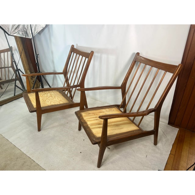 For sale is this great pair of vintage lounge chairs that are made out of walnut.