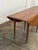 W72.5 D22 D48 H28.25 KC27 Vintage drop leaf dining table attributed to Edward Wormely for Dunbar. Item is structurally...
