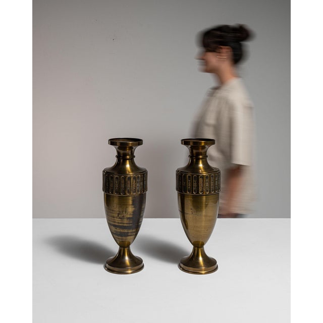 This early 20th century vase from France is finished in brass. Its form follows honest, well-proportioned lines typical of...