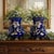 A striking matched pair of Victorian-style cobalt blue jardinière vases featuring sculptural ring handles, paw-foot bases,...