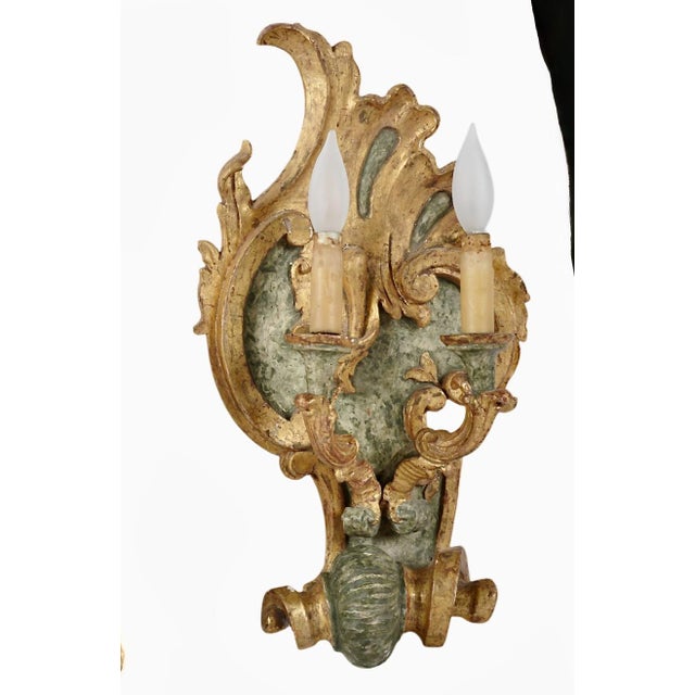 This is a very decorative pair of 18th century Italian Gilt and marbelized double candle sconces. Both of the sconces are...