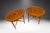 Pair of Mahogany oval side tables accented with satinwood inlay and borders early 20th Century. The pair is finished on...