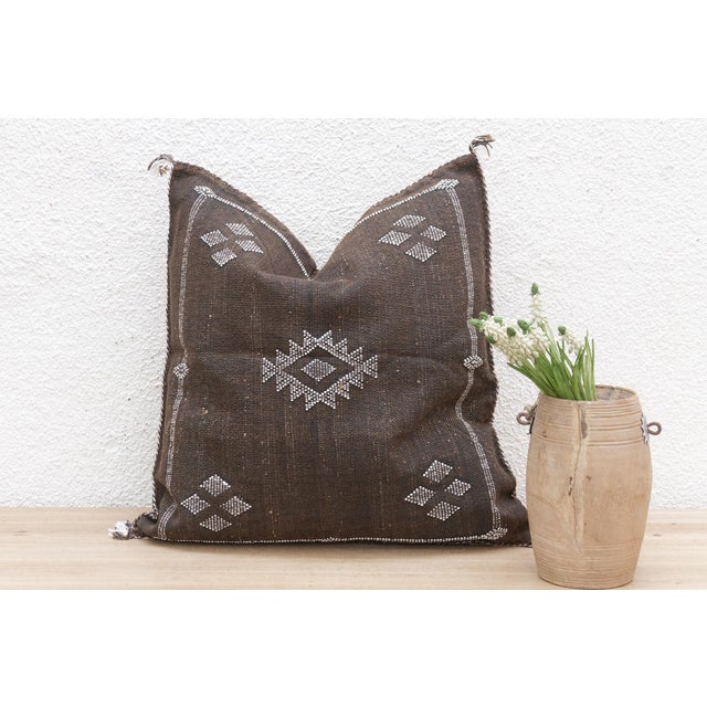 Indulge in the artistry of our handcrafted Moroccan cactus silk pillow, measuring approximately 22 inches square. Woven...