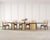 A monumental and rare signed sectional dining table constructed from brass and lacquered walnut designed by India Mahdavi...