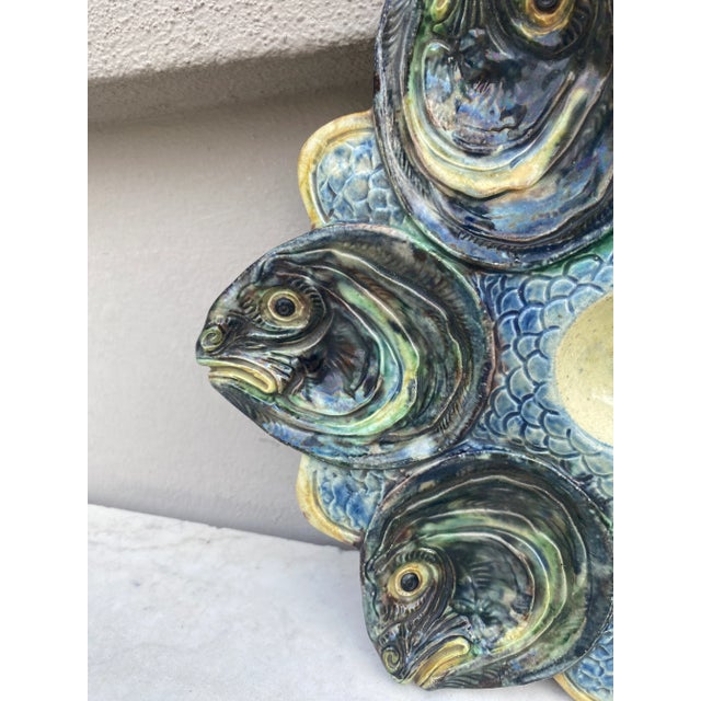Rare Majolica Palissy oyster plate attributed to Thomas Sergent with fishs heads, circa 1880.