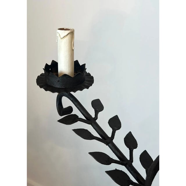 This beautiful decorative 5-arm chandelier is made of wrought iron. The chandelier is decorated with leaves on the arms....