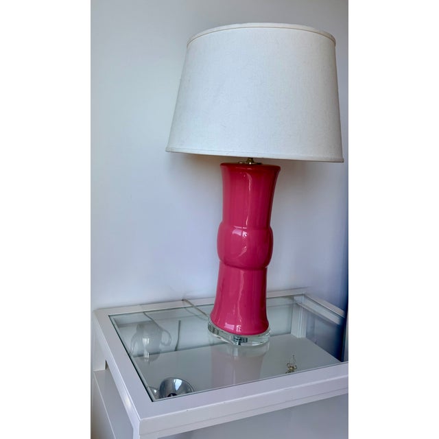 Add a bold, designer statement to your space with this striking pair of Ethan Allen table lamps in a vibrant pink glass...
