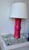 Add a bold, designer statement to your space with this striking pair of Ethan Allen table lamps in a vibrant pink glass...