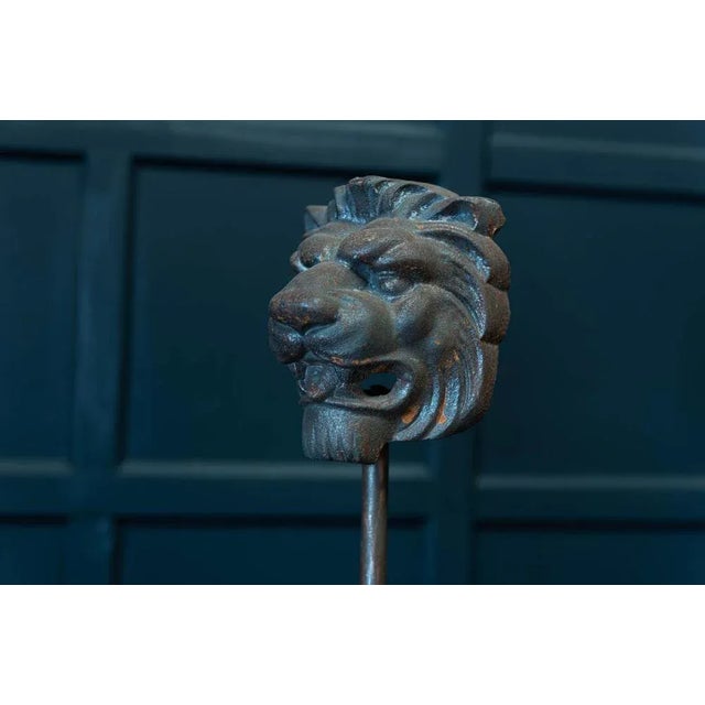 Antique 19th century english pair of cast iron mounted lion masks circa 1890. Measures: large h 49 x w 19.5 x d 11cm small...