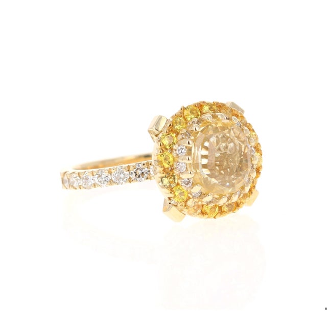 This ring has a Round Oval Cut Yellow Sapphire that is GIA Certified. The Yellow Sapphire is natural and is a NON-HEATED...