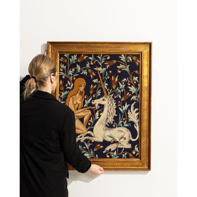 This 1960s wall hanging from France is a tapestry, housed in a tapestry frame. It is distinguished by its unicorn, a...